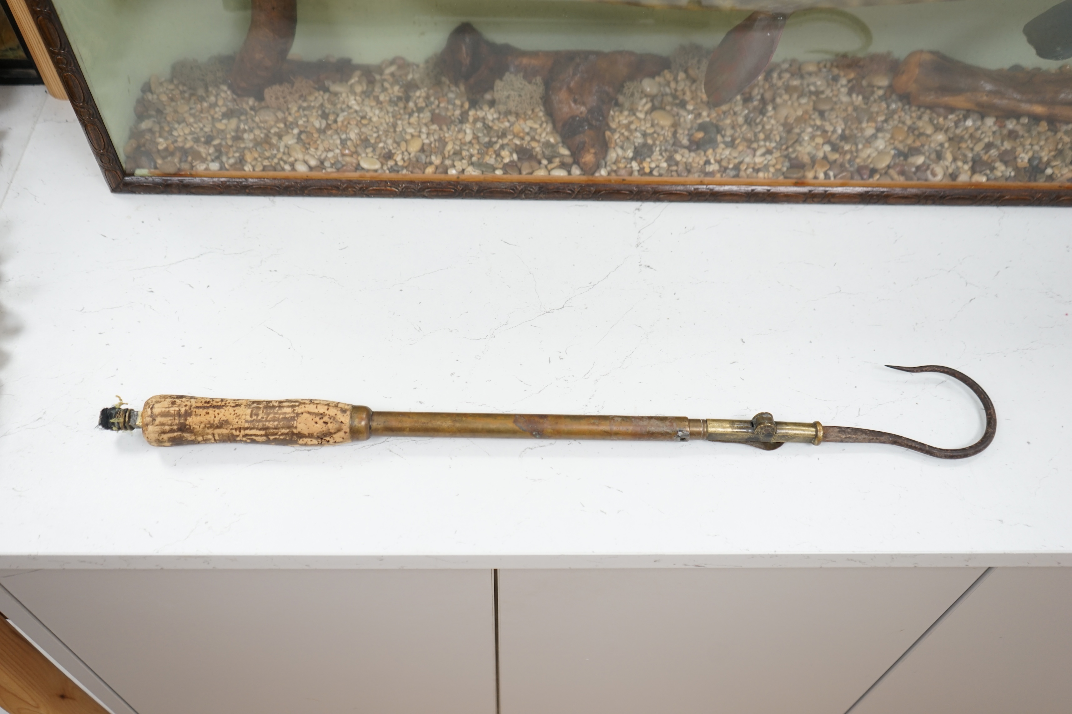 A 19th century folding and extending salmon gaff with cork grip, 58.5cm long. Condition - cork handle damaged one end